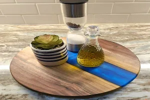 wood and blew epoxy lazy Susan with some olive oil some condiments and salt and pepper shaker